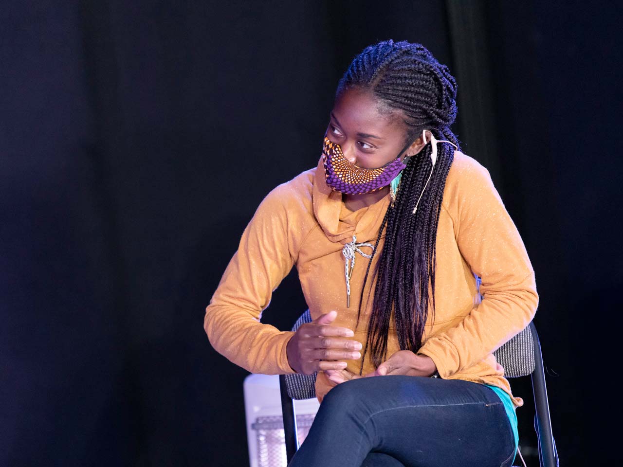 Union PDX - Festival:20 artist Oluyinka Akinjiola of Rejoice! Diaspora Dance Theatre wearing a yellow shirt speaks at the live-streamed artist discussion at Polaris Dance Theatre in Portland, Oregon | Photography: Jingzi Zhao