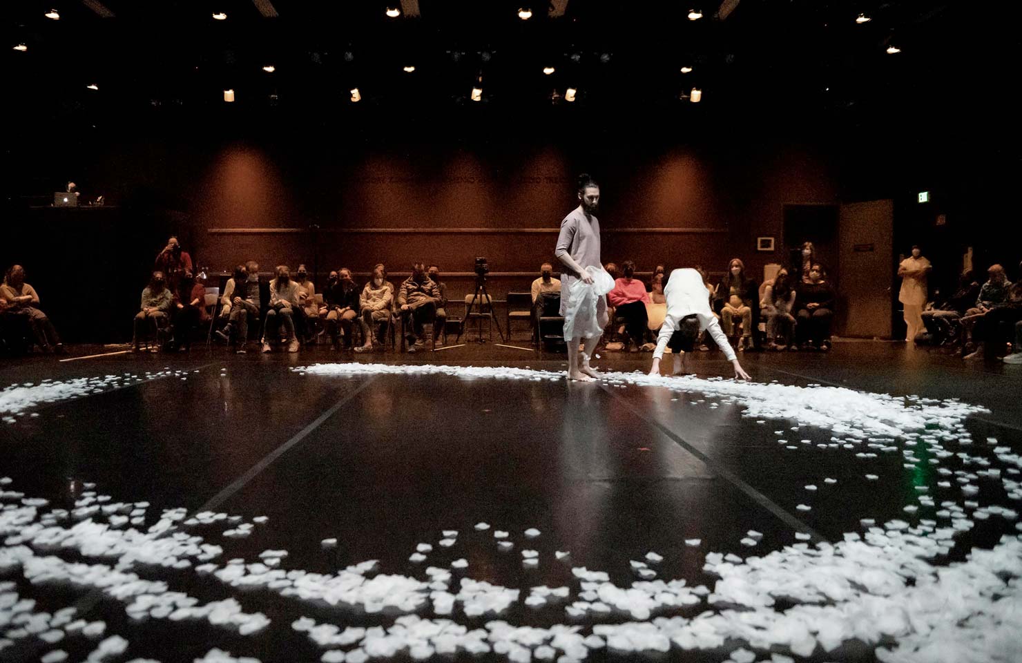 Union PDX - Festival:21 director Samuel Hobbs walks in a ceremonial enzo pathway of flower petals during the student show | Photography: Jingzi Zhao