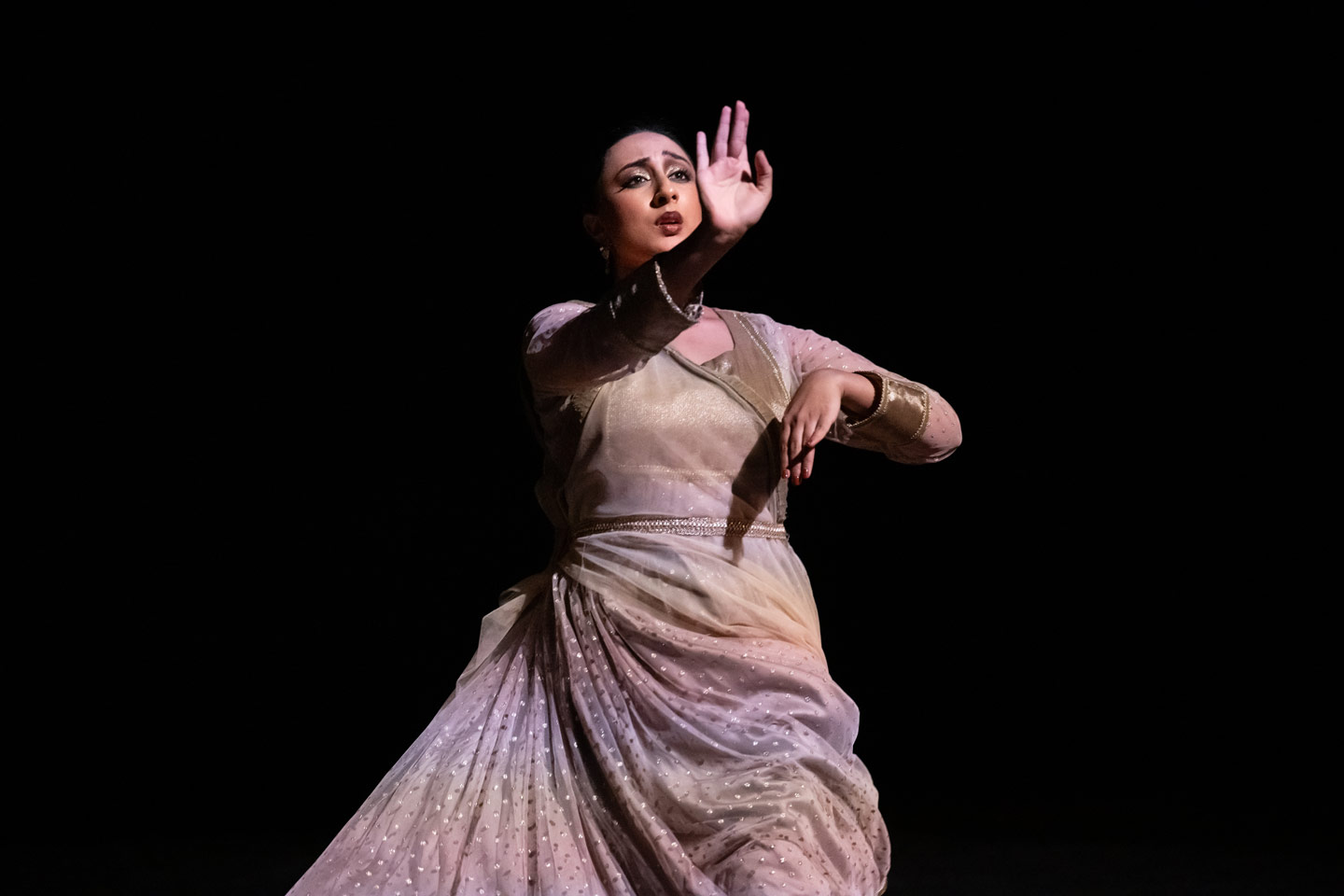 Union PDX - Festival:26 artist Tarkia Nath performs in their work 'Sampark'. Photo depicts Nath performing and gesturing from an emotional spin. | Photography: Jingzi Zhao